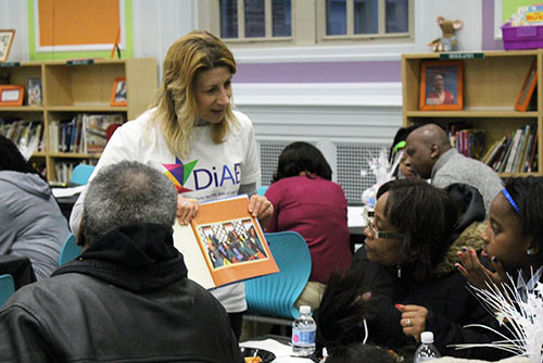 nanci hersh reading to a group of people