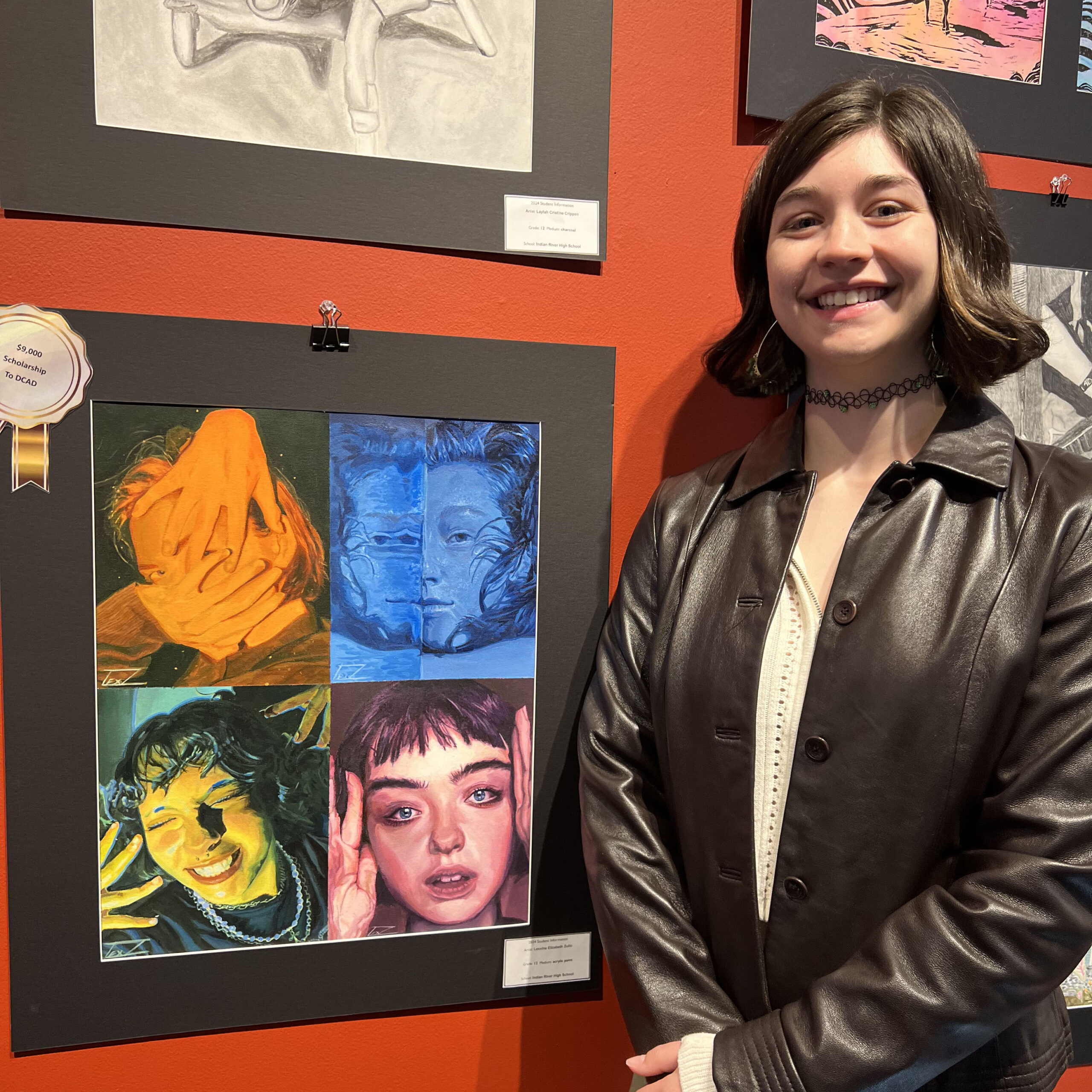 certificateofartsexcellence Student standing in front of artwork at Rehoboth Art League